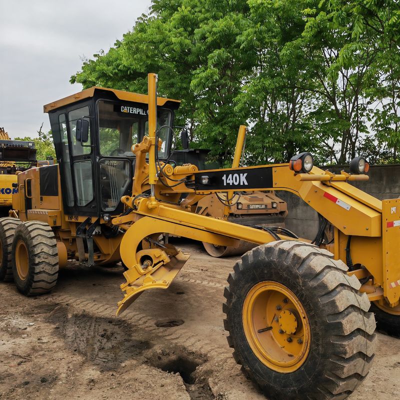 ماشین حفاری استفاده شده زمین تراش Caterpillar CAT140K ماشین جاده ای دست دوم موتور تراکتور ژاپن در وضعیت خوب
